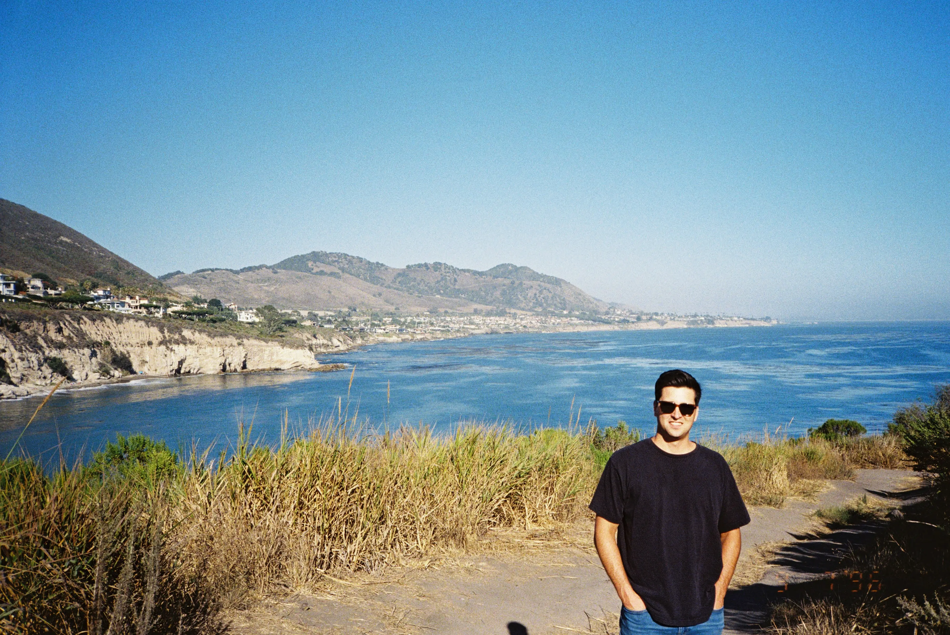 Cole Robinson on the coast trail above the ocean